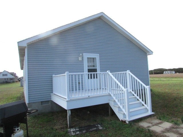 back of property featuring a deck