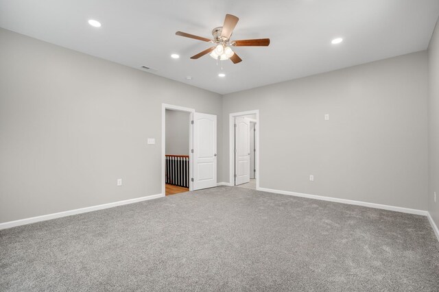 unfurnished bedroom with carpet flooring, recessed lighting, and baseboards