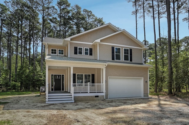 craftsman house with a garage, dirt driveway, and a porch