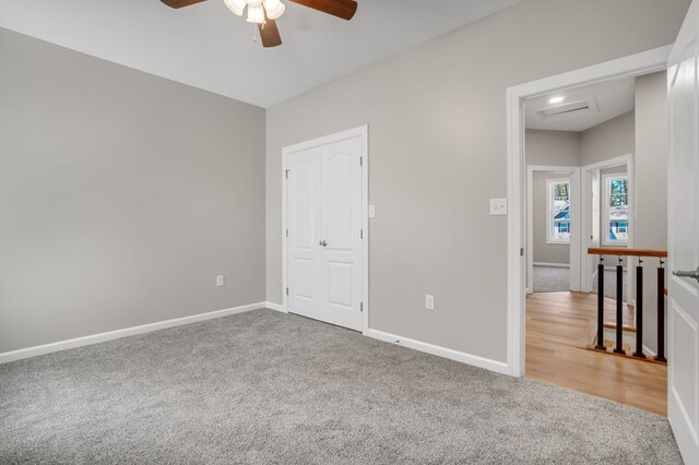 unfurnished bedroom featuring carpet flooring, baseboards, and ceiling fan
