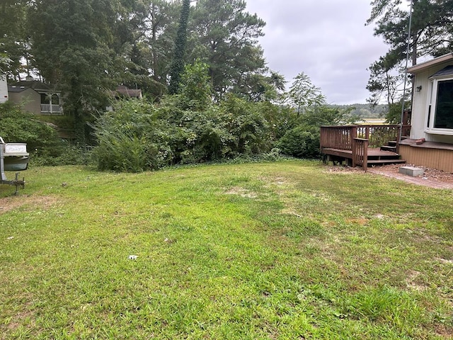 view of yard with a deck