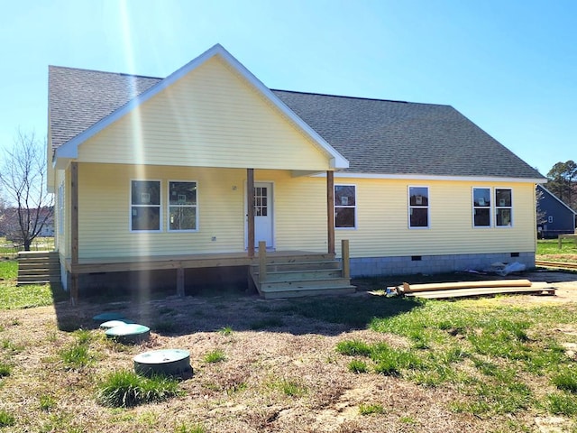 view of front of home with crawl space, a porch, and roof with shingles