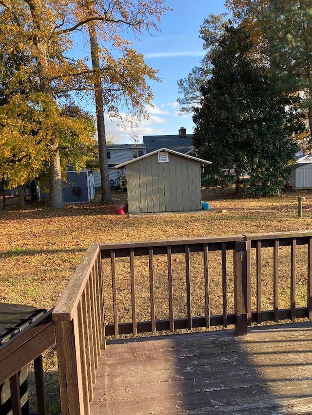 wooden deck with a shed