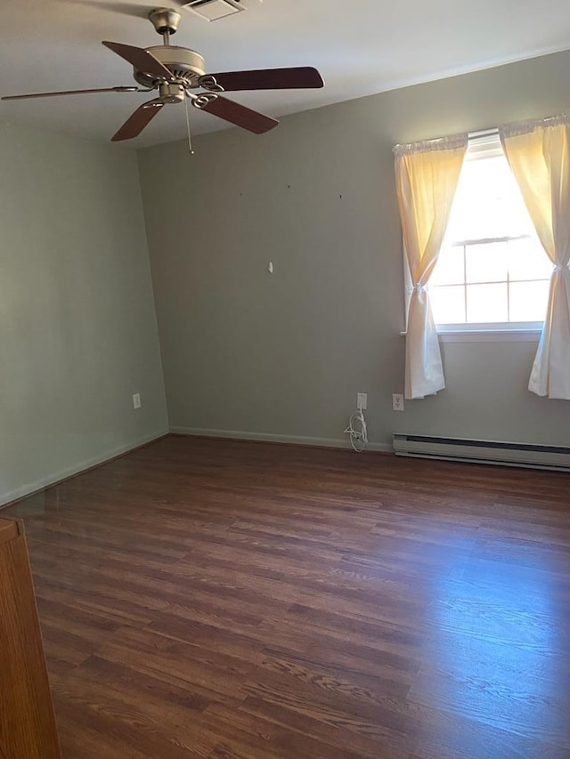 unfurnished room with a baseboard radiator, ceiling fan, and dark wood-type flooring