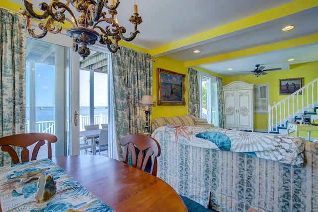 6180 Marsh Island Dr, Chincoteague, VA 23336 - living area with beamed ceiling, ceiling fan, stairs, and a chandelier