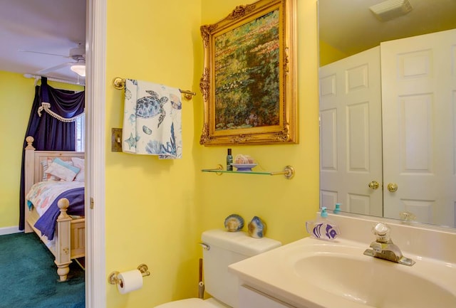 6180 Marsh Island Dr, Chincoteague, VA 23336 - ensuite bathroom featuring a sink, toilet, and a ceiling fan