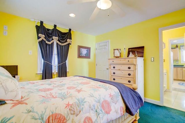 6180 Marsh Island Dr, Chincoteague, VA 23336 - carpeted bedroom with recessed lighting, tile patterned floors, ceiling fan, baseboards, and ensuite bath