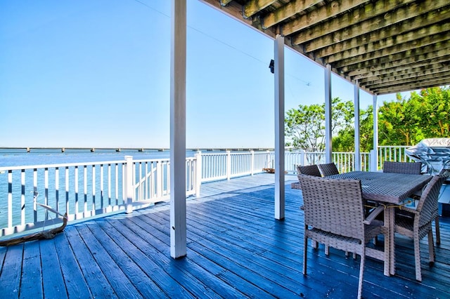 6180 Marsh Island Dr, Chincoteague, VA 23336 - wooden deck with outdoor dining area and a water view