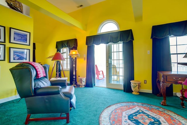 6180 Marsh Island Dr, Chincoteague, VA 23336 - living area featuring carpet floors, baseboards, and lofted ceiling