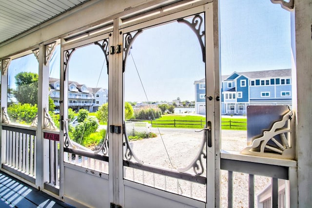 6180 Marsh Island Dr, Chincoteague, VA 23336 - doorway to outside with french doors and a residential view