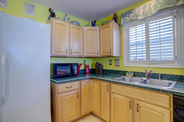 6180 Marsh Island Dr, Chincoteague, VA 23336 - kitchen featuring black appliances, a sink, light brown cabinetry, and dark countertops