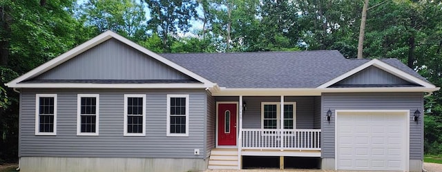 view of front of house with a garage and a porch