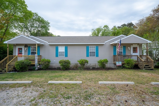 single story home featuring covered porch, a shingled roof, a front yard, and uncovered parking