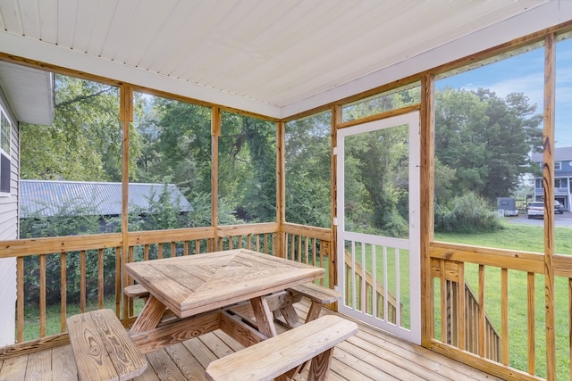 sunroom with outdoor dining area