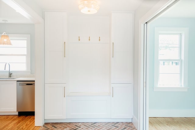 mudroom with plenty of natural light and a sink