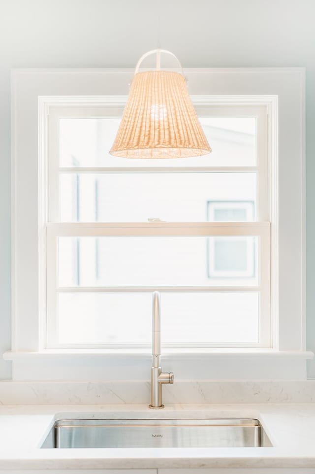 details featuring a sink and light countertops