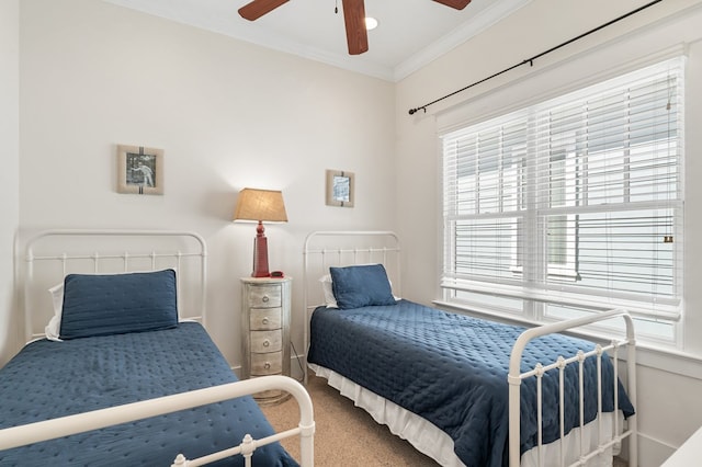 bedroom featuring crown molding, a ceiling fan, and carpet floors