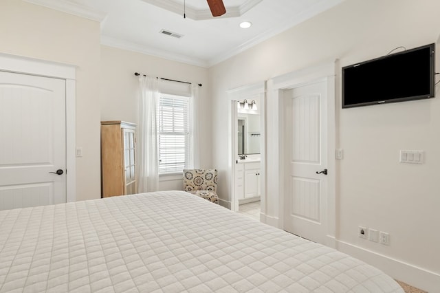 bedroom featuring baseboards, visible vents, ensuite bath, ceiling fan, and ornamental molding