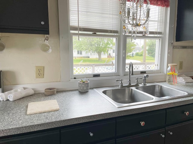 kitchen featuring plenty of natural light and sink