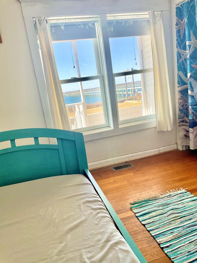 unfurnished bedroom featuring hardwood / wood-style flooring