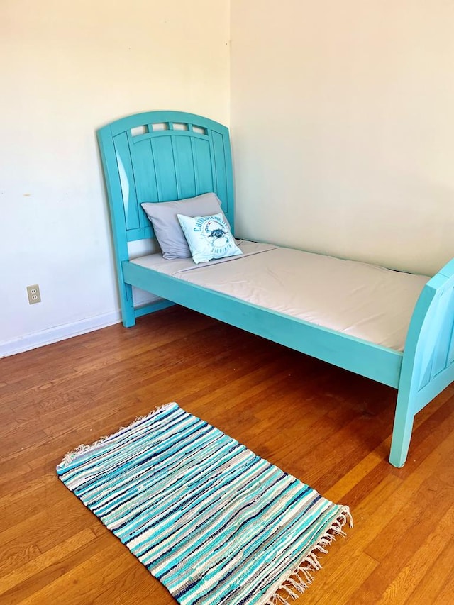 bedroom featuring wood-type flooring