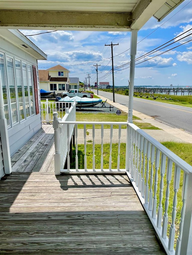 wooden terrace with a porch