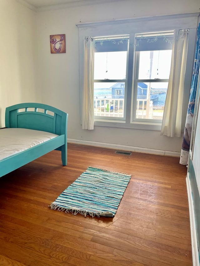 bedroom with hardwood / wood-style flooring