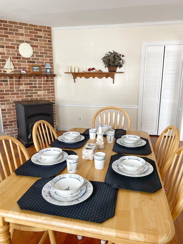 dining space with a wood stove