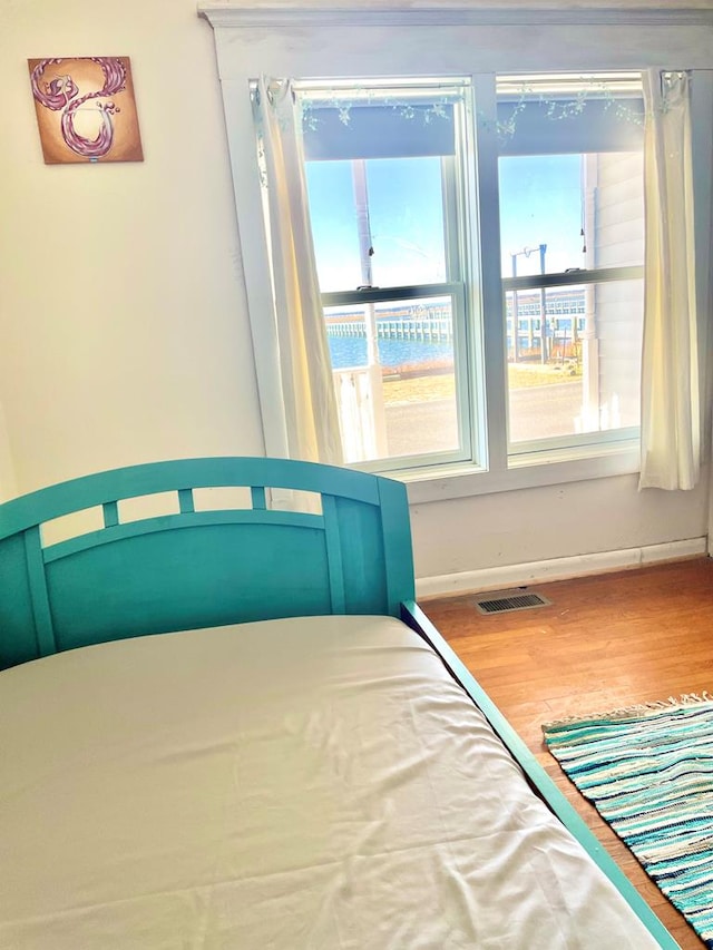 unfurnished bedroom featuring hardwood / wood-style floors