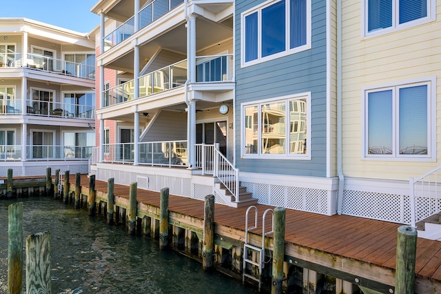 rear view of house featuring a water view