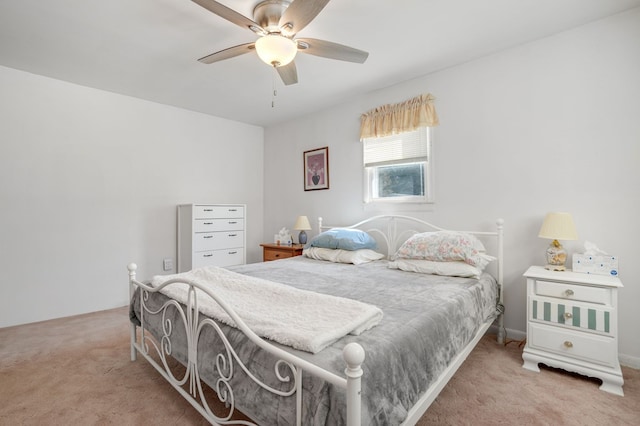 bedroom featuring light carpet and ceiling fan