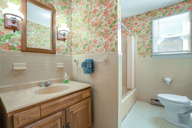 full bathroom featuring vanity, toilet, shower / bath combo with shower curtain, and tile walls
