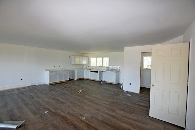3365 Peaceful Ln, Chincoteague, VA 23336 - unfurnished living room with dark wood-type flooring and baseboards