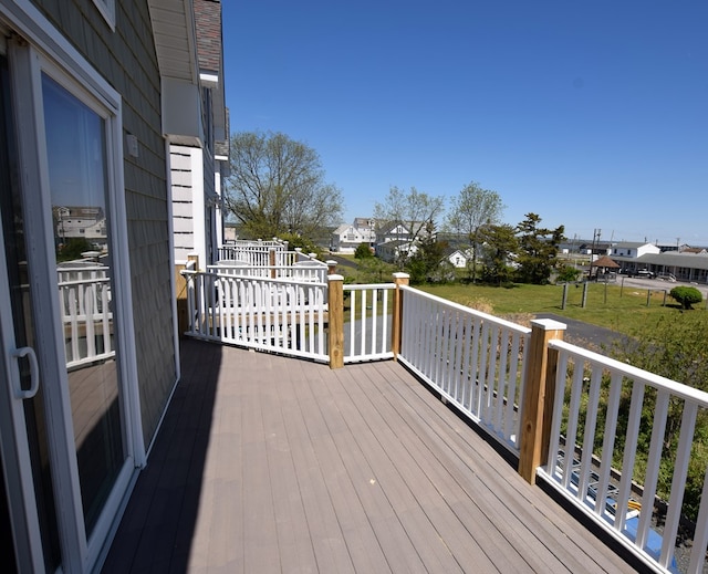 3365 Peaceful Ln, Chincoteague, VA 23336 - wooden terrace featuring a residential view