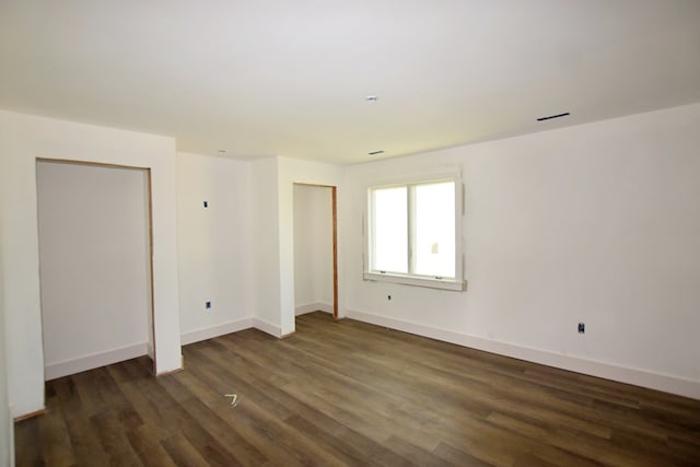 3365 Peaceful Ln, Chincoteague, VA 23336 - spare room featuring dark wood-style floors and baseboards