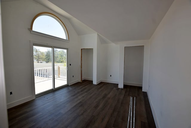3365 Peaceful Ln, Chincoteague, VA 23336 - unfurnished room with dark wood-type flooring, baseboards, and lofted ceiling