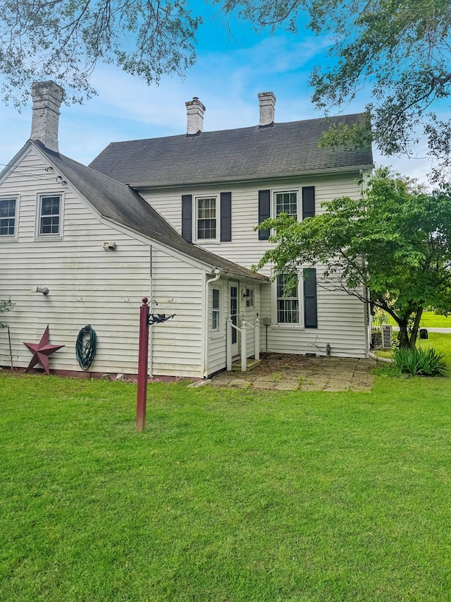 25539 Shoremain Dr, Bloxom, VA 23308 - rear view of property with a yard and a chimney