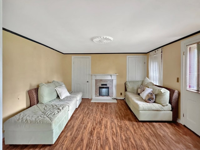 25539 Shoremain Dr, Bloxom, VA 23308 - living room with wood finished floors, crown molding, a fireplace, and baseboards