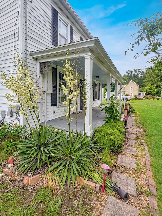 25539 Shoremain Dr, Bloxom, VA 23308 - view of home's exterior with a porch and a yard
