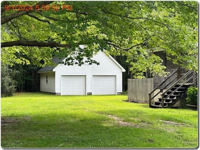 garage with a lawn