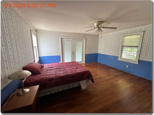 bedroom featuring ceiling fan, dark hardwood / wood-style flooring, french doors, and ornamental molding