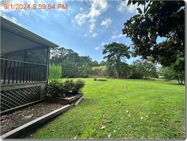 view of yard with a sunroom