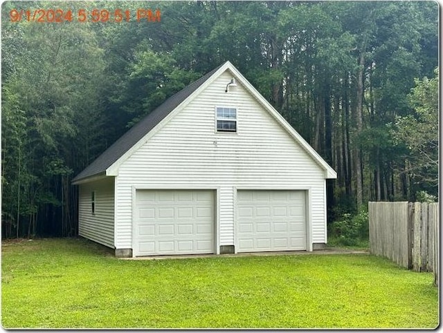 garage with a yard