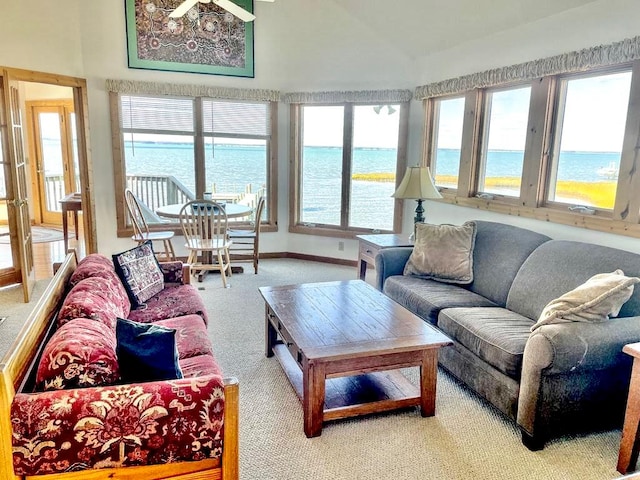 5108 Wildcat Ln, Chincoteague, VA 23336 - carpeted living area featuring vaulted ceiling and a water view