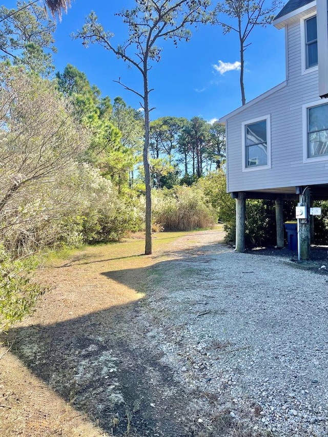 5108 Wildcat Ln, Chincoteague, VA 23336 - view of yard with driveway and a carport