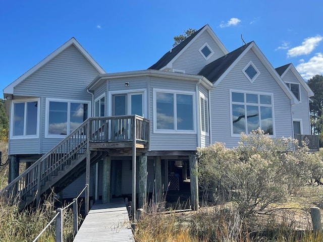 5108 Wildcat Ln, Chincoteague, VA 23336 - rear view of house featuring a wooden deck and stairway