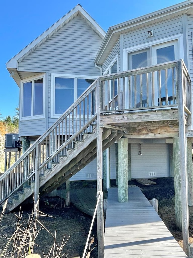 5108 Wildcat Ln, Chincoteague, VA 23336 - rear view of property with stairway and a wooden deck