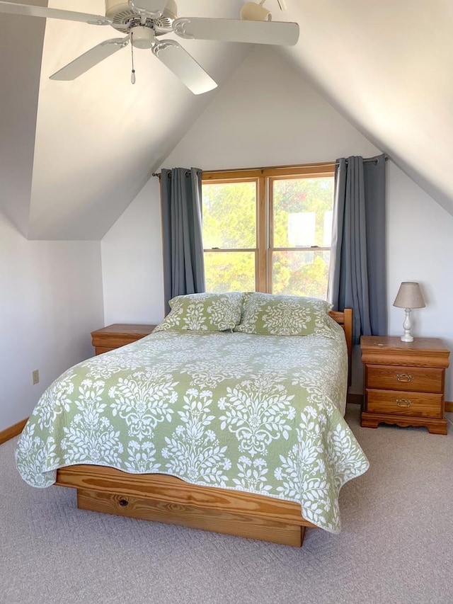 5108 Wildcat Ln, Chincoteague, VA 23336 - bedroom with carpet flooring, vaulted ceiling, and a ceiling fan