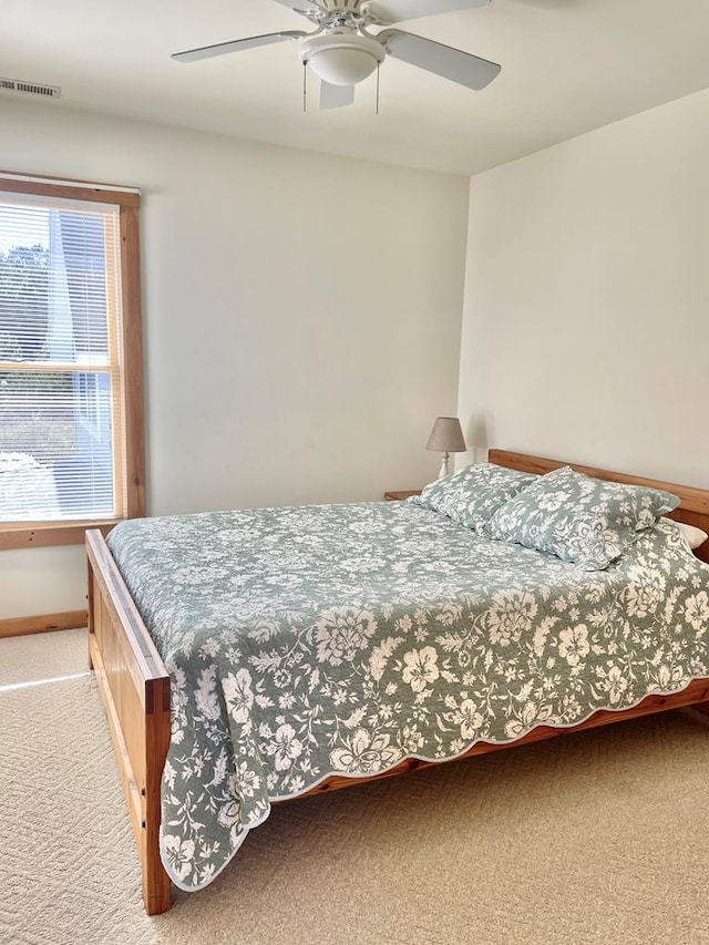 5108 Wildcat Ln, Chincoteague, VA 23336 - carpeted bedroom with a ceiling fan