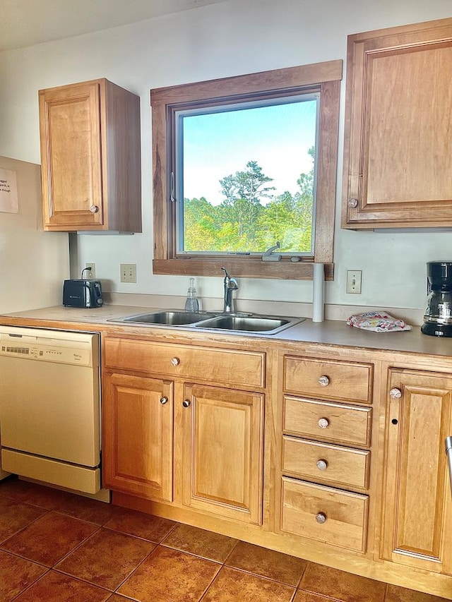 5108 Wildcat Ln, Chincoteague, VA 23336 - kitchen featuring white dishwasher, dark tile patterned flooring, and light countertops